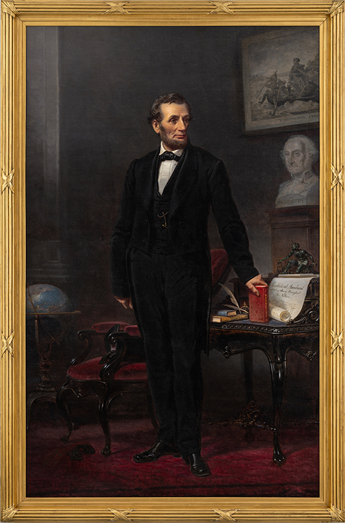 Full length portrait of a man in a black suit standing with books and documents